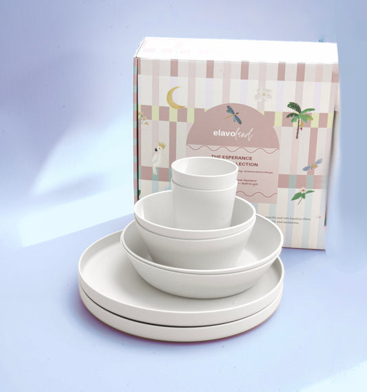Stack of white plates bowls and cups with packaging that is attractive.