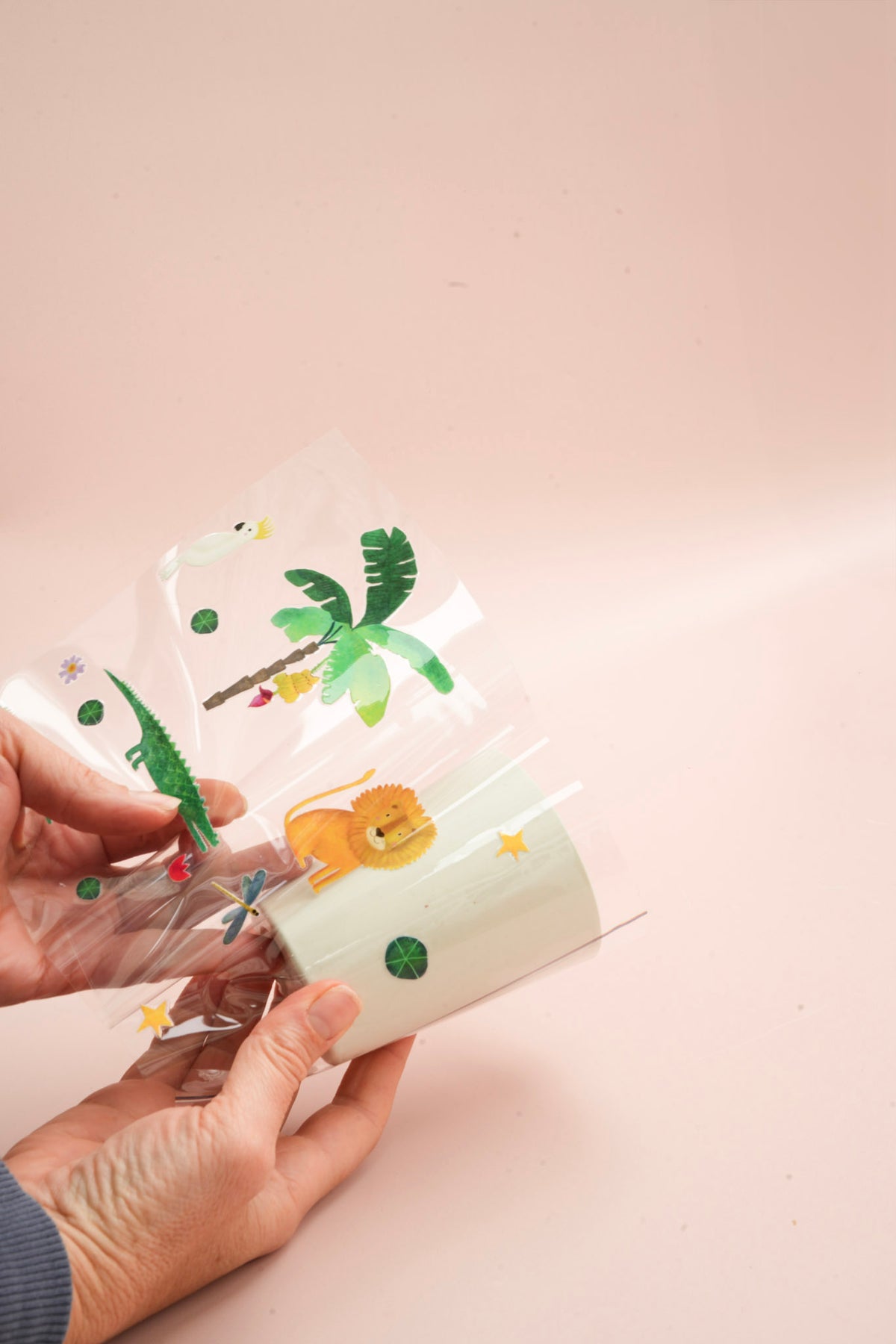 Adding sticker to s white kids cup