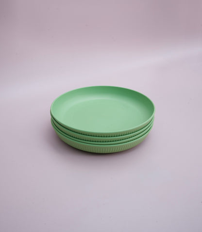 Green wheat straw plates in a stack