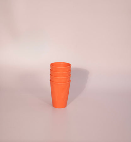 Orange cups made from wheat straw.