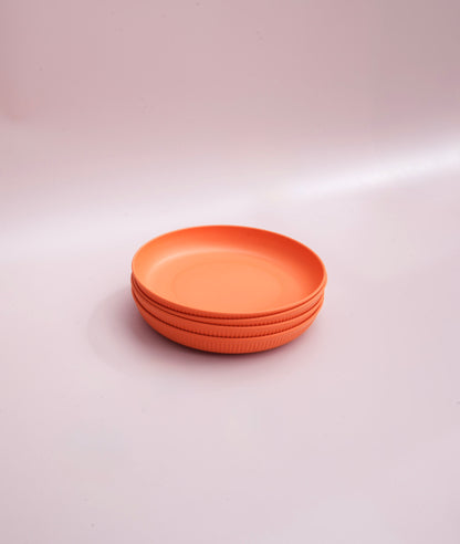Beautifully designed blue wheat straw plates for kids and adults in orange.