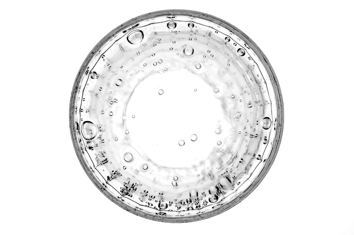 Clear glass bowl with bubbles on a white background