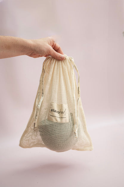 Stack of plates in a mesh bag.